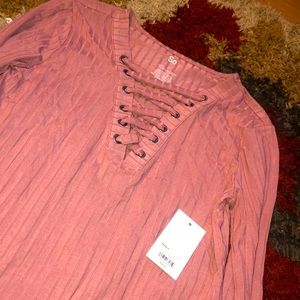 Cross front blush colored long sleeve tee
